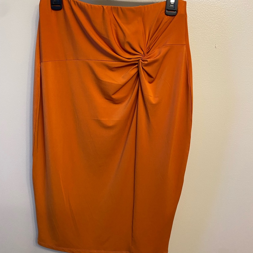 Sexy orange ruched skirt will accent your curves.